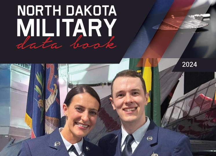 Cover of Data Book with female and male Air Force Airman holding a certificate of Family of the Year